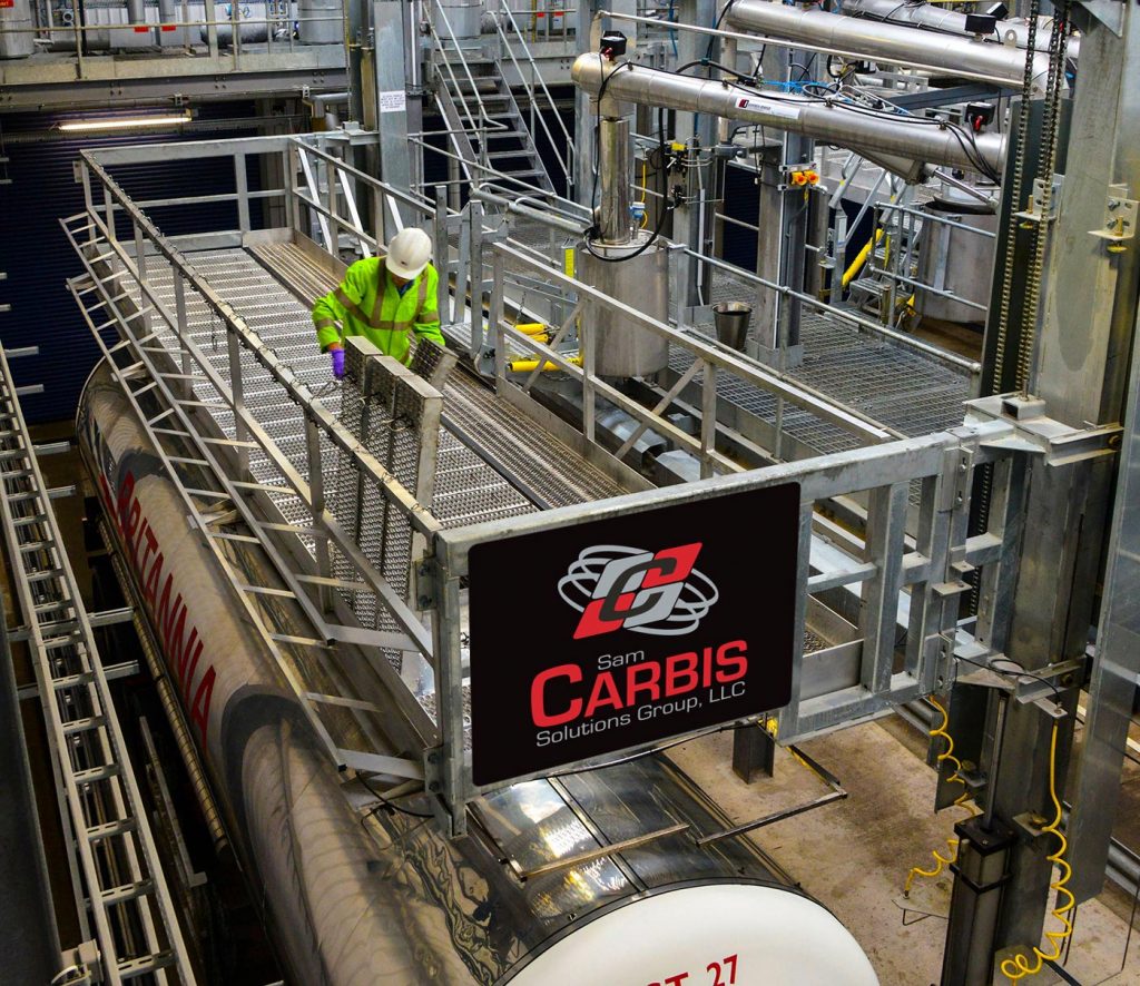 A man works from a Carbis Solutions elevated truck platform.