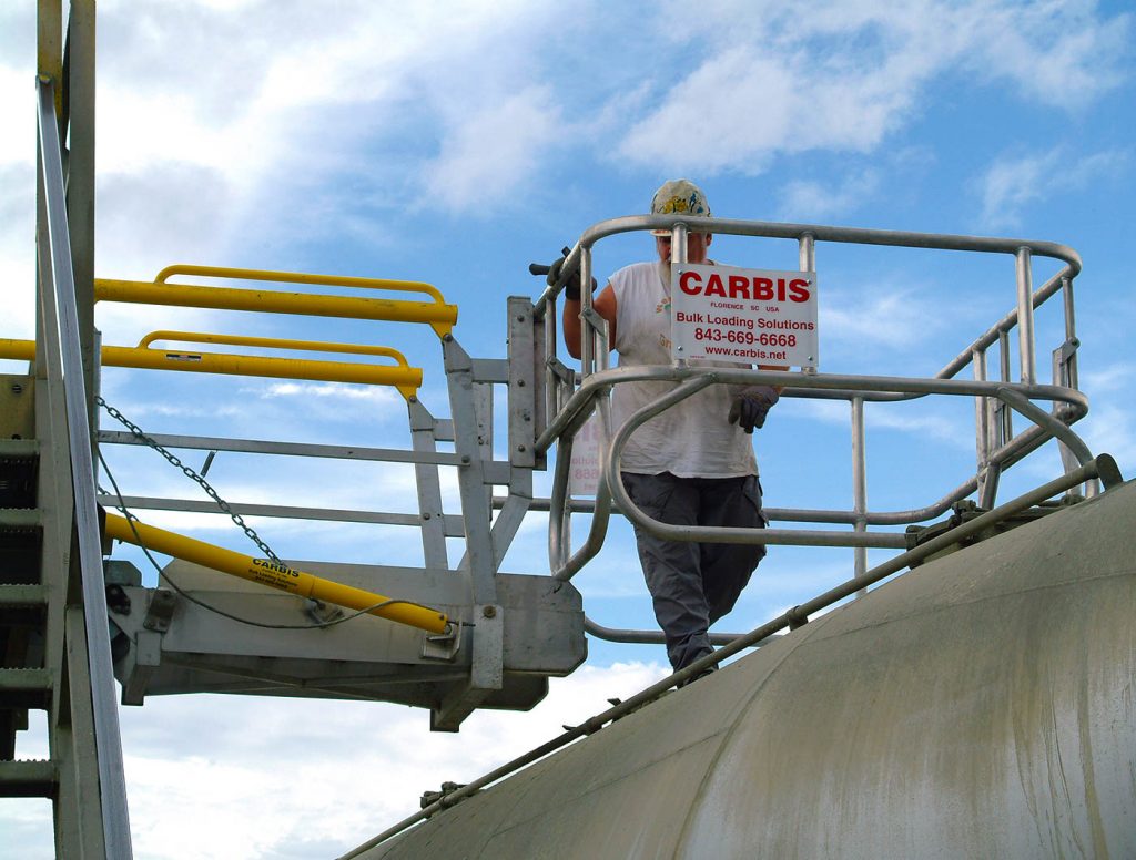 Carbis single hatch fall protection loading system with a man on the top of a vessel truck underneath it.