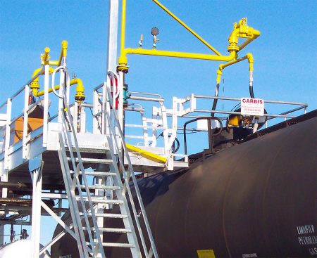 Unit train loading platform above a tanker railcar.