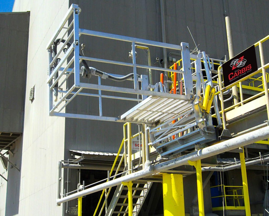A custom safety cage stands high on a loading dock.