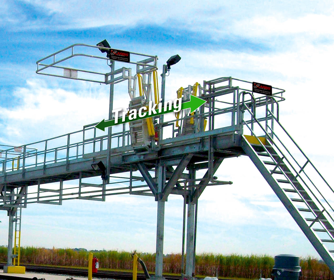 A track mounted gangway is shown on a loading platform.