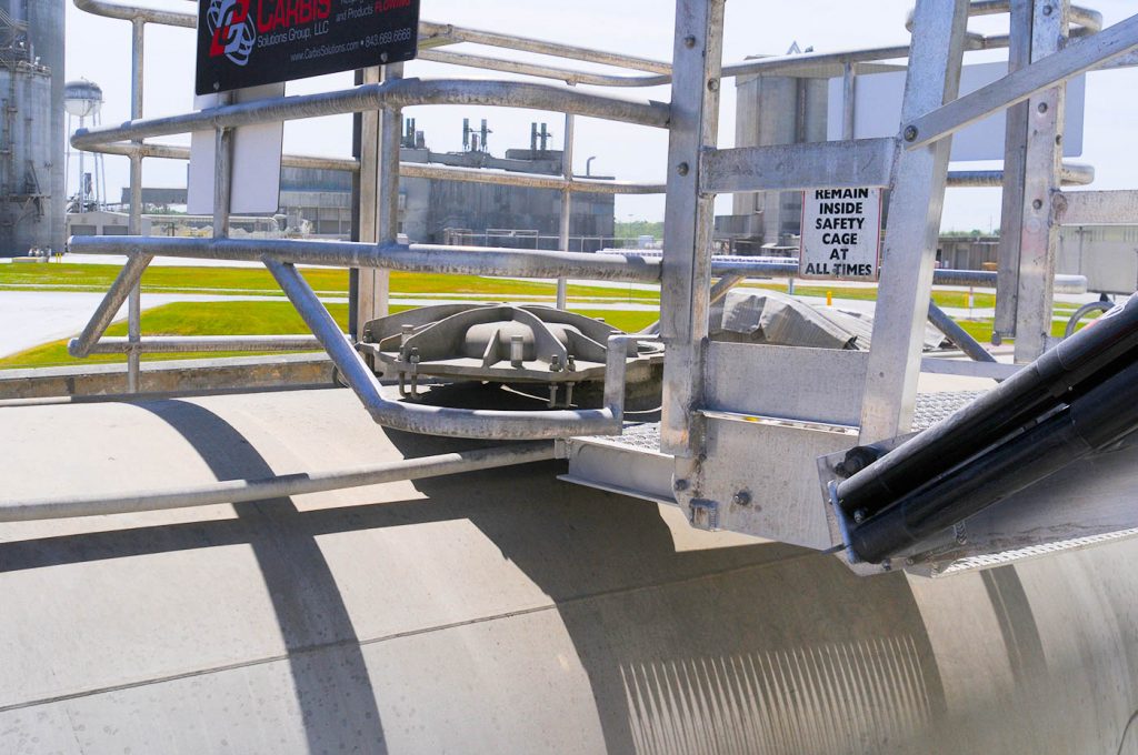 A truck safety cage sits atop a tanker truck.
