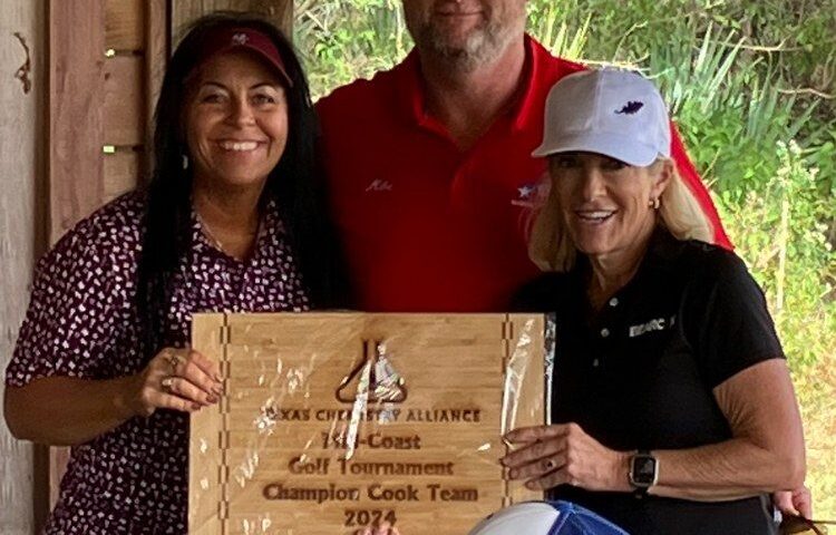 Weighing Technologies of the greater Houston, Texas area showing a plaque for being the championship cook team.