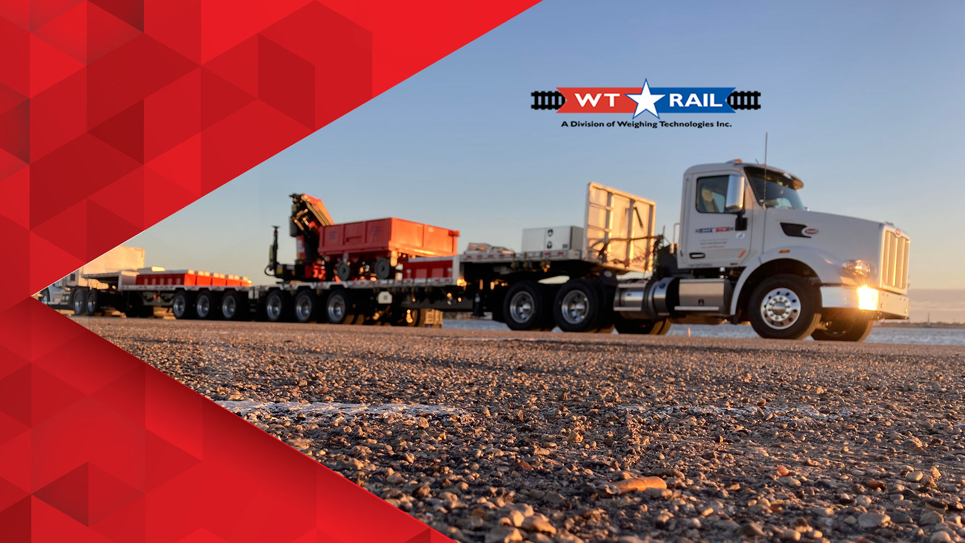 Weigh-tech Rail is a branch of Weigh-Tech focused on railroad scales and services. The picture is of some railroad scale equipment on the beds of two 18-wheeler open trailers.
